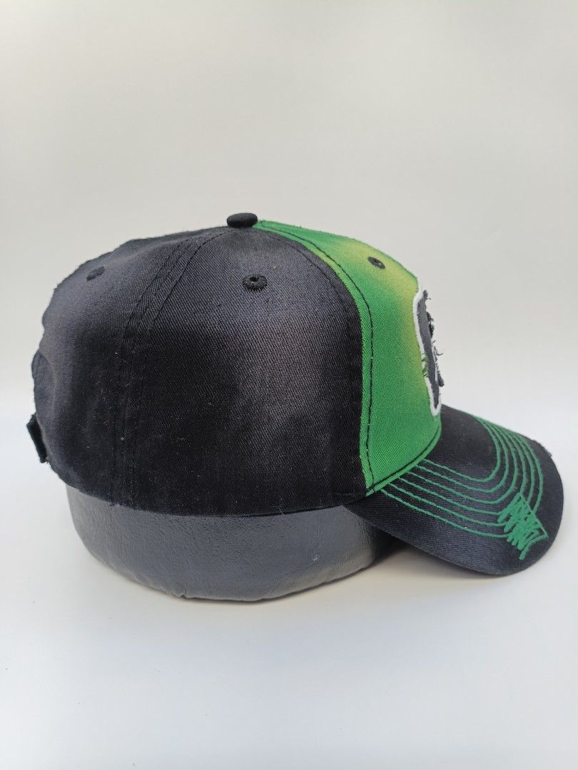 Budweiser St. Patrick's Day Clover Distressed Baseball Cap (Category: Caps & Hats) located in Imus. Submitted by grindhouse.thriftshop (Listing ID 1469400030, Image 2). Description: - Official Budweiser merchandise with interior tag - Unique green and black distressed styling with gradient spray effect - Front patch features a shamrock graphic and embroidered branding - Adjustable strap closure for a customized fit - Great piece for collectors or