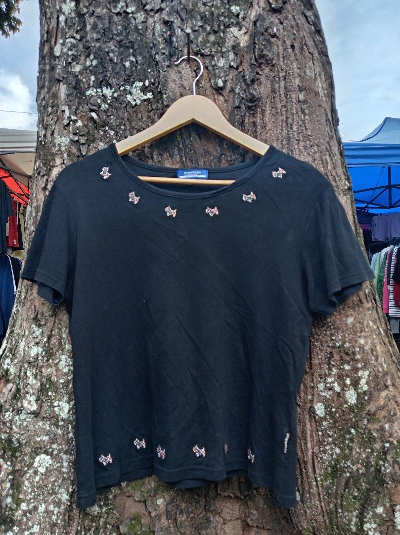 Burberry blue label (Category: Luxury Apparel) located in Malaybalay. Submitted by cjsv0228 (Listing ID 1469477024, Image 1). Description: Burberry tops blue level Size 42 on tag imbroid all logo As new no issue 680 shipp.
