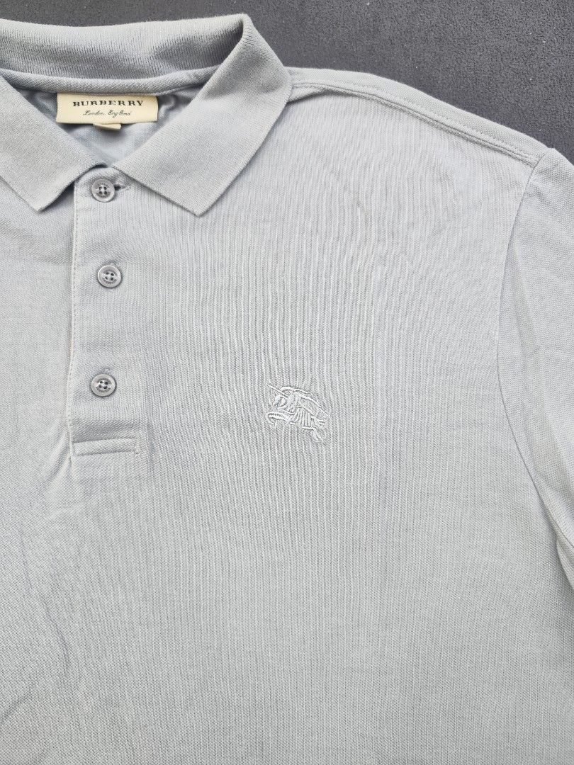 Burberry Polo Tee (Category: Luxury Apparel) located in Bulacan. Submitted by emilj23 (Listing ID 1469434584, Image 2). Description: Burberry Polo Tee Size XXL on tag L 29 W 23 Condition 9.5/10 Color rate 9.5/10 Issue Pinhole.