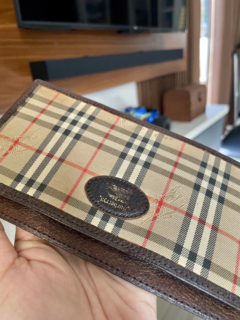 Burberrys Vintage Check Long Wallet (Category: Luxury Bags & Wallets) located in Paranaque City. Submitted by ol.authentic.ph (Listing ID 1469572302, Image 3). Description: - Authentic vintage Burberrys long wallet - Iconic nova check pattern with dark brown leather trim - Elegant oval logo plaque on the front - Slim profile with multiple compartments for cards and cash - Minor wear from normal use, great for everyday styling.