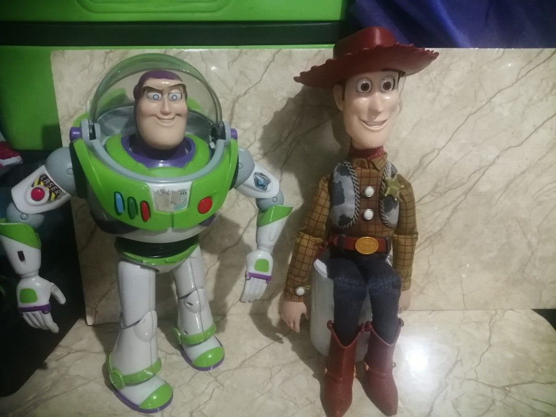 Buzz and Woody Thinkway Vintage (Category: Interactive Toys) located in Pateros City. Submitted by romferarc333 (Listing ID 1469435566, Image 1). Description: Vintage Buzz and Woody 1995/96 release Interactive toys from Thinkway Toys Buzz -working voice and lights -no wing effect (just a design hidden wings) -missing left thumb -paint chips Woody: -working voice box -no pull string (first release version) -push button on shirt -faded vest and clo