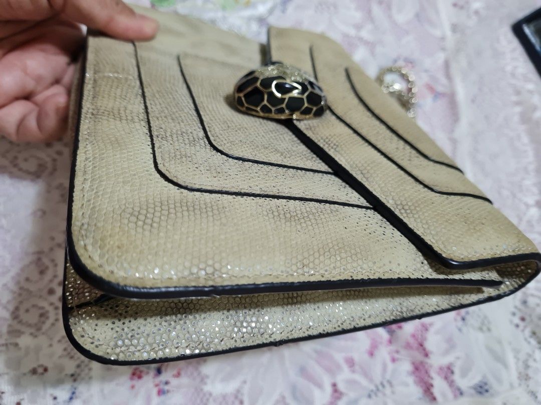 Bvlgari (Category: Luxury Bags & Wallets) located in Bulacan. Submitted by kraeyon_shop (Listing ID 1469536988, Image 3). Description: ✔️ Preloved Bvlgari Serpenti Forever shoulder bag crafted from metallic or water snake/karung leather in a neutral grey-beige tone, featuring the iconic enamel-and-metal snakehead closure and a snake-inspired chain strap..