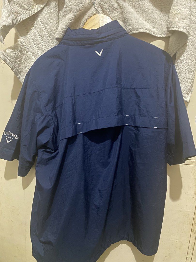 Callaway Golf Navy Blue Rain Jacket Windbreaker (Category: Coats, Jackets and Outerwear) located in Davao. Submitted by biggyhere (Listing ID 1469458916, Image 2). Description: - Brand: Callaway Golf - Color: Navy Blue with white embroidery - Style:windbreaker jacket with hood and zip-up front with detachable sleeves - Features: Functional pockets, vented back yoke, and lightweight weather-resistant fabric - Branding: White embroidery on chest, s