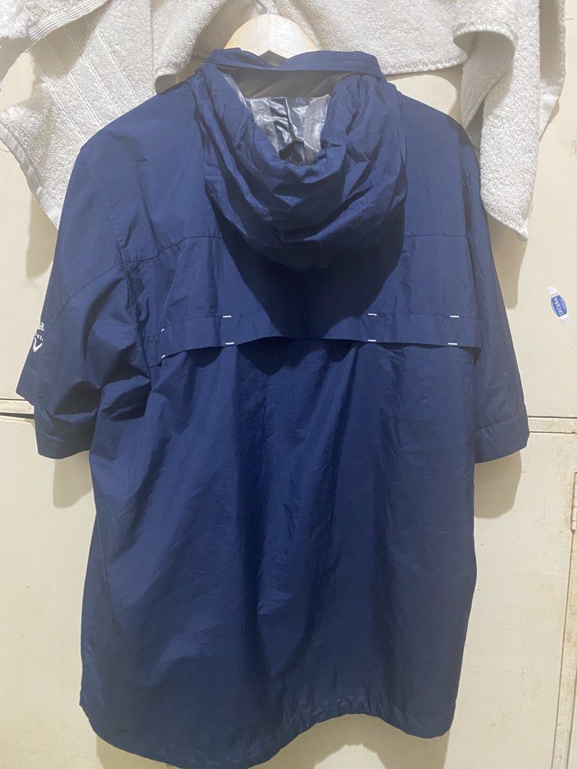 Callaway Golf Navy Blue Rain Jacket Windbreaker (Category: Coats, Jackets and Outerwear) located in Davao. Submitted by biggyhere (Listing ID 1469458916, Image 3). Description: - Brand: Callaway Golf - Color: Navy Blue with white embroidery - Style:windbreaker jacket with hood and zip-up front with detachable sleeves - Features: Functional pockets, vented back yoke, and lightweight weather-resistant fabric - Branding: White embroidery on chest, s