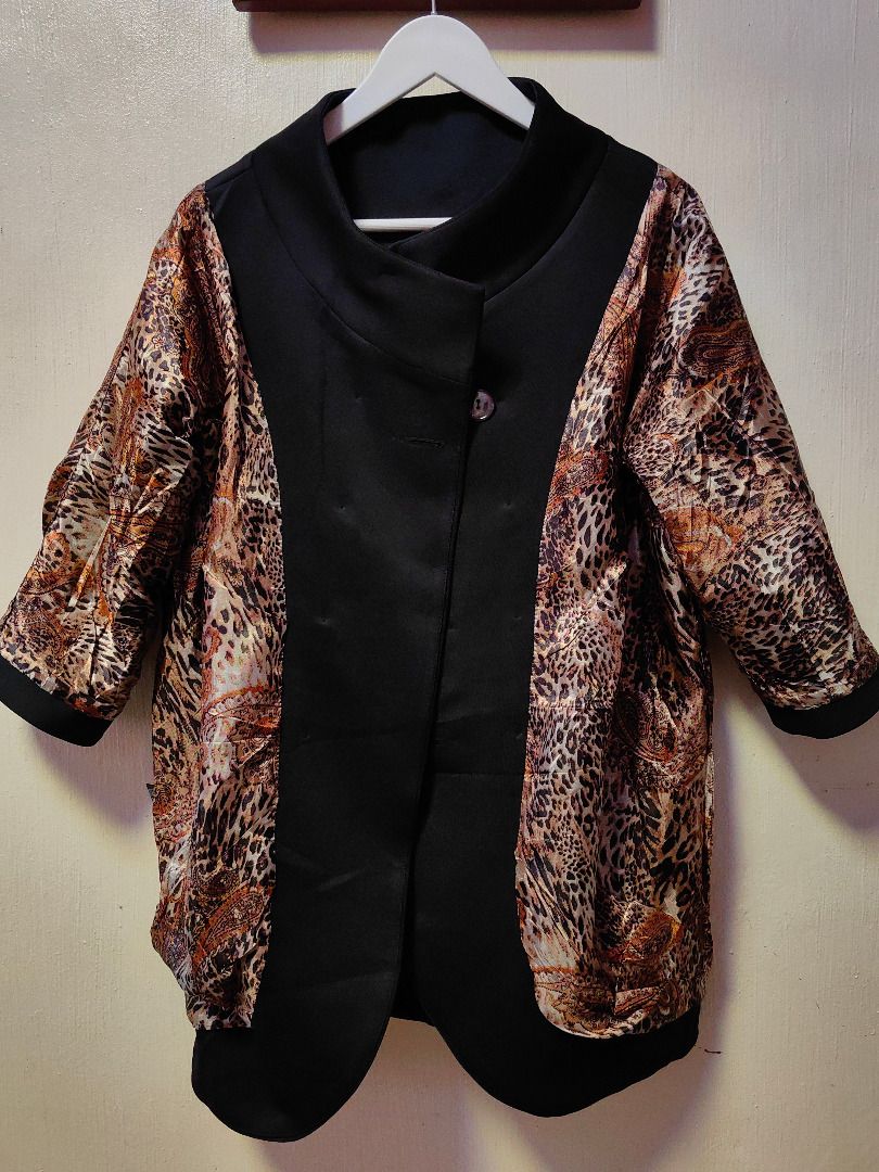 Calvin Klein Double-Breasted Coat with Leopard Lining (Category: Coats, Jackets and Outerwear) located in Tarlac. Submitted by jeremiah.curator.2026 (Listing ID 1469107458, Image 3). Description: - Brand: Calvin Klein - Style: Double-breasted coat with funnel neck and snap button closure - Color: Classic Black - Size: L (Tag attached) - Features: Three-quarter sleeves with folded cuffs, practical side pockets, and a stylish leopard and paisley in