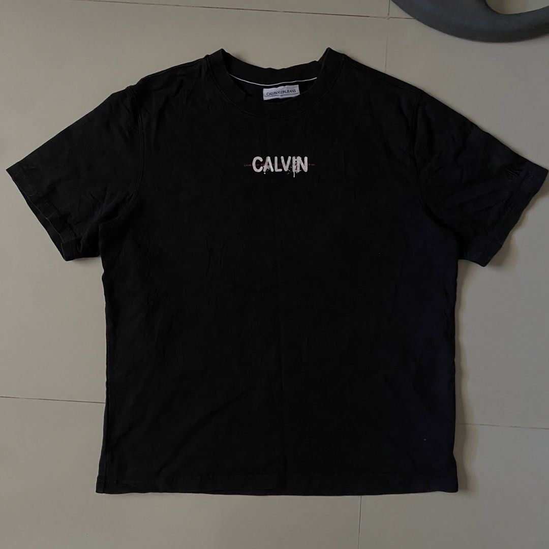 Calvin Klein Graphic tee (Category: Formal Shirts) located in Iligan City. Submitted by renzreyong66220 (Listing ID 1469444238, Image 1). Description: - Brand: Calvin Klein Jeans - Condition: Brand new with interior tags and care labels - Size: Medium - Color: Black - Front: Small Calvin logo print on the chest - Back: Large statement triple LOVE graphic print with ck branding - Sleeve: Small embroidered ck logo on the left sleeve - Neckline: Cre
