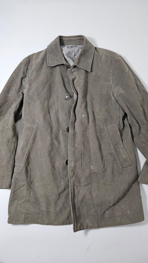 Calvin Klein Grey Cotton Jacket (Category: Coats, Jackets and Outerwear) located in Alfonso. Submitted by jbcamet (Listing ID 1469516724, Image 1). Description: - Brand: Calvin Klein - Color: Unique greyish-brown - Size: Medium (Regular Fit) - Material: 100% cotton shell with premium cupro lining - Design: Button-up front, classic collar, and convenient side pockets - Condition: Excellent, clean inner lining and intact branded neck tag - Style: L