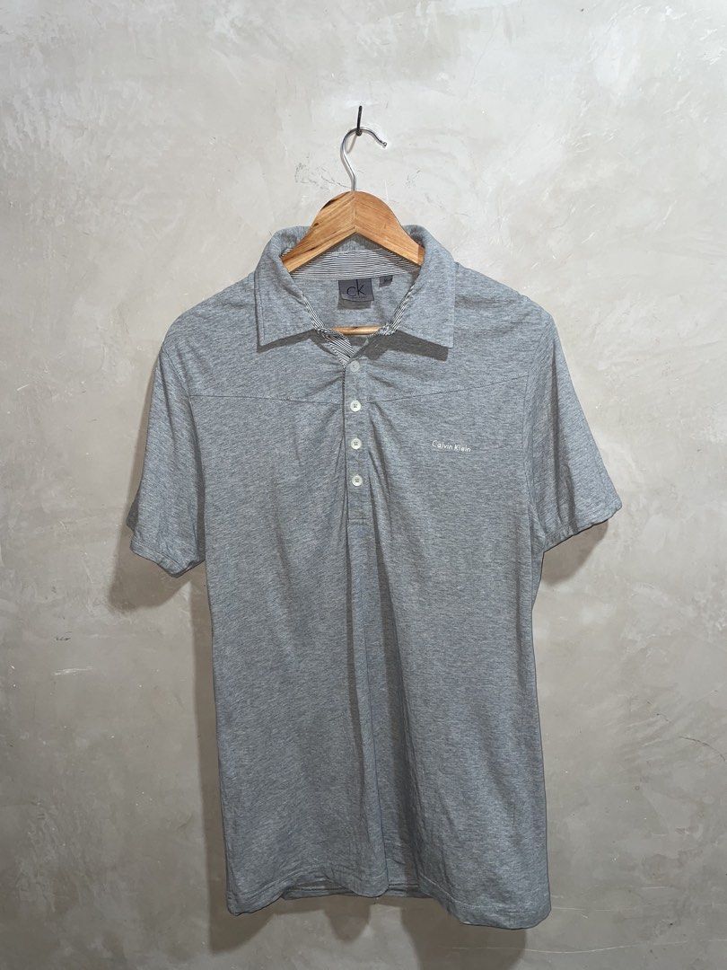 Calvin Klein Grey Polo Shirt (Category: Tshirts & Polo Shirts ) located in Molave. Submitted by thriftedstore.horse (Listing ID 1469517262, Image 1). Description: Condition- excellent Issue- none Color rate- 9.5/10.
