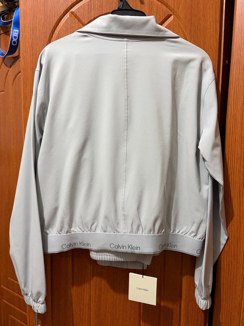 Calvin Klein Jacket & Jogger Set Gray Small - Medium (Category: Sets or Coordinates) located in Quezon City. Submitted by beckyshop2024 (Listing ID 1469566624, Image 2). Description: - Brand new with tag - Original from US - Windbreaker Set - Runs big, S on tag, fits up to Semi- large.