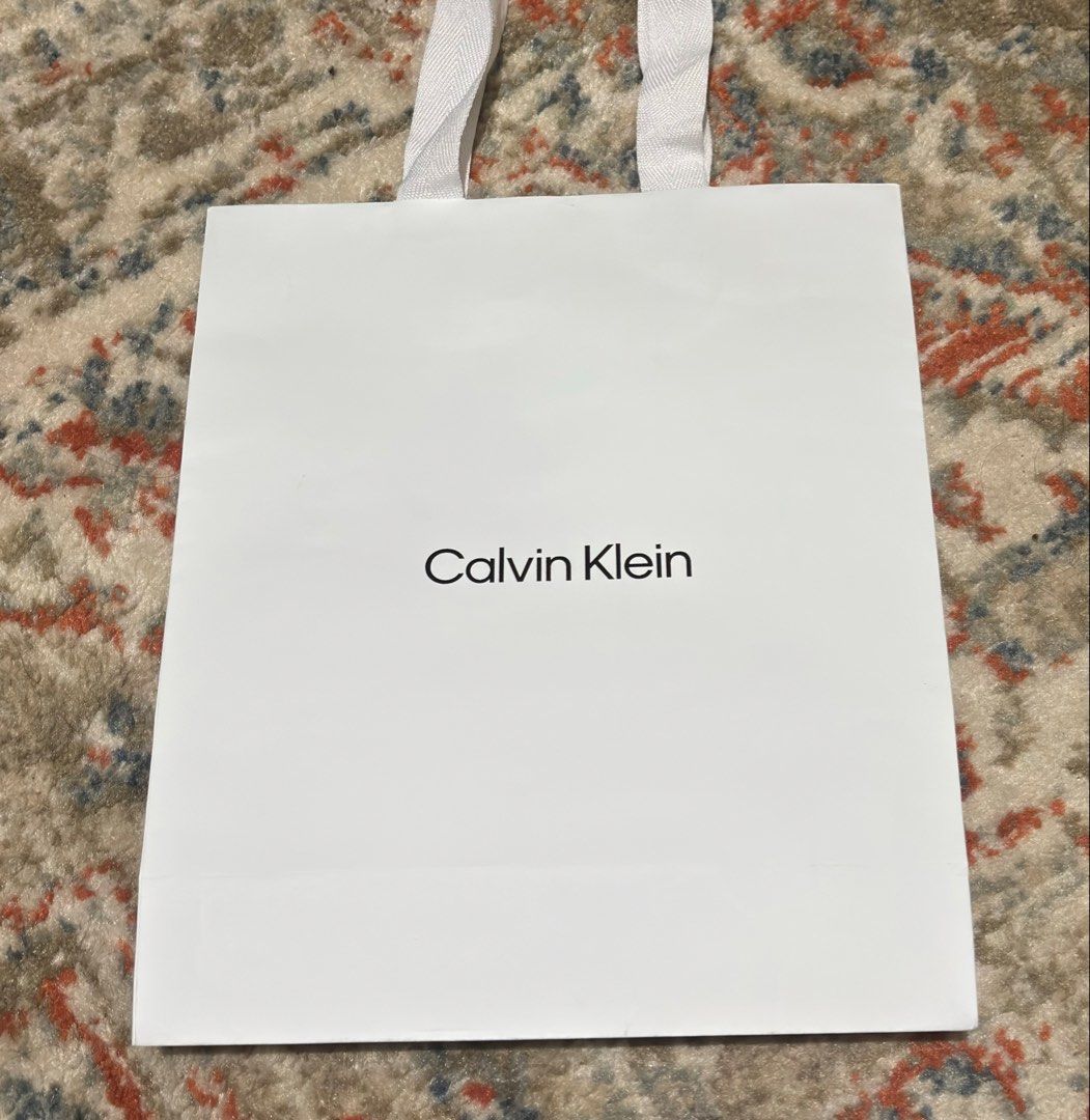 Calvin Klein White Paper Bag (Category: Tote Bags) located in Manila. Submitted by nikashoppe (Listing ID 1469526697, Image 1). Description: Authentic Calvin Klein white paper bag .