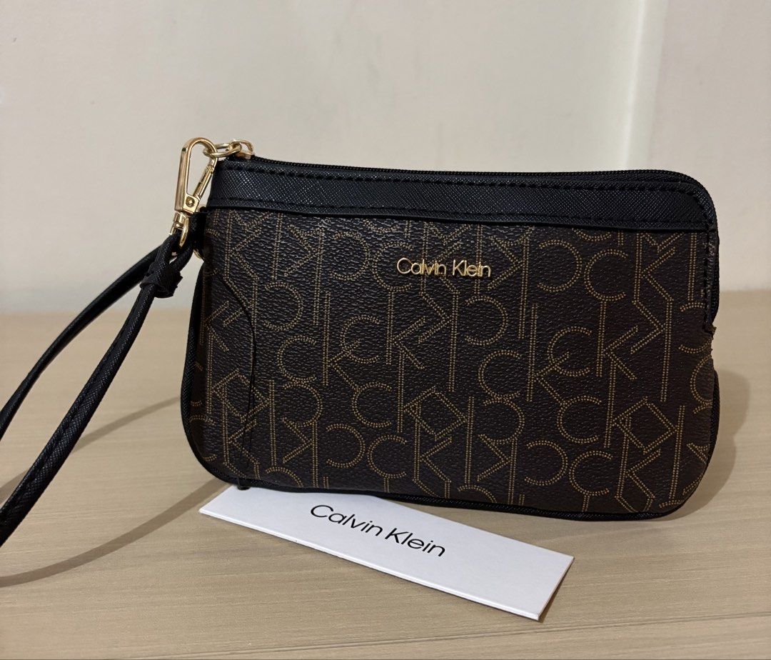 Calvin Klein Zip Wristlet (Maple Brown/Black) (Category: Wallets & Card holders) located in Cavite. Submitted by chubbsavenue (Listing ID 1469458110, Image 1). Description: .