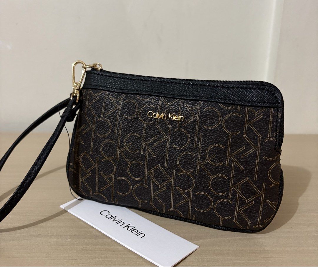 Calvin Klein Zip Wristlet (Maple Brown/Black) (Category: Wallets & Card holders) located in Cavite. Submitted by chubbsavenue (Listing ID 1469458110, Image 2). Description: .