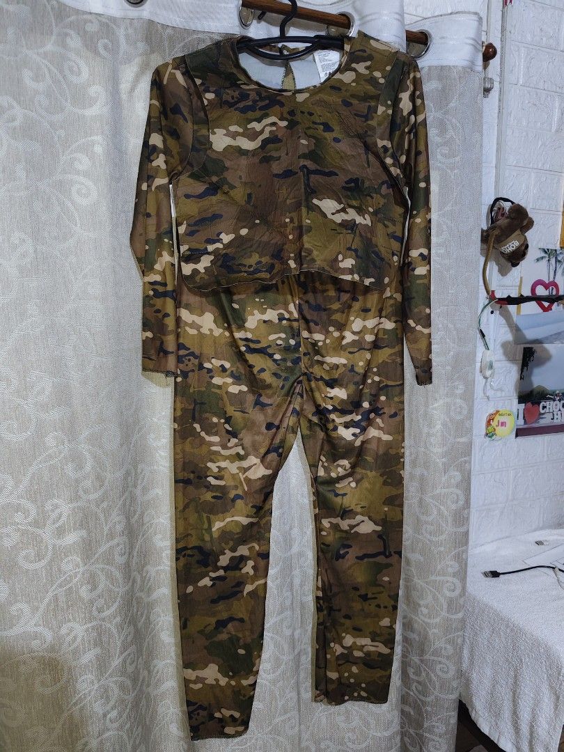 Camouflage Print Long Sleeve Jumpsuit (Category: Babies & Kids Fashion) located in Manila. Submitted by duffy-080 (Listing ID 1469394220, Image 3). Description: - Style: Camouflage print long-sleeve jumpsuit with matching top and pants - Pattern: Green and brown army print - Fit & Comfort: Full-length style made from stretchy, easy-to-pull-on fabric - Details: Chic cutout detail at the back neck - Versatility: Great costume option or statement lo