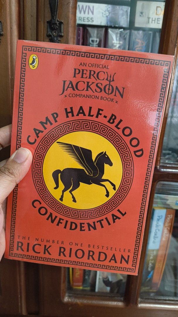 Camp Half-Blood Confidential - Rick Riordan (Category: Storybooks) located in Carmona. Submitted by wisemountain-_- (Listing ID 1469464647, Image 1). Description: - Title: Camp Half-Blood Confidential - Author: Rick Riordan - Publisher: Puffin - Format: Paperback - Condition: Clean pages, solid spine - Perfect for Percy Jackson fans and Greek mythology lovers.