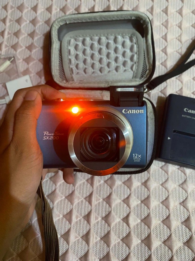 Canon PowerShot SX200 IS (Category: Cameras) located in Manila. Submitted by mystic.wisteria (Listing ID 1469477368, Image 1). Description: Canon PowerShot SX200 IS 🏷️8500 (Negotiable for sure buyers) -with pop up flash -with red light -12x optical zoom (28–336mm 35mm-film equivalent) -12.1 megapixel -Has different modes -HD Videos Issue: signs of usage only (no functional issue, fully working) Full inclusion: Camera Original Battery Original Ch