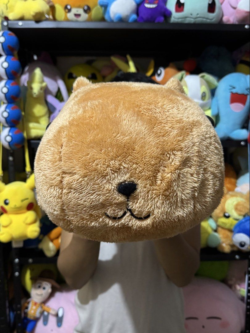Capybara plush toy stuffed animal pillow (Category: Plushies & Soft Toys) located in Cainta. Submitted by mayhroeen (Listing ID 1469487826, Image 2). Description: - Large capybara plush toy with soft brown fur - Features cute stitched face details and compact ears - Very huggable size, perfect as a cushion or cuddle buddy - Brand new with tag still attached on the side - Clean and fluffy texture all around.