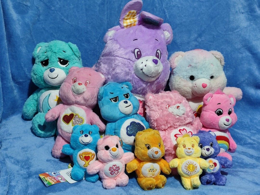 Care Bears Plush Toys Medium & Large Collection (Category: Plushies & Soft Toys) located in Baguio. Submitted by abigailmyra (Listing ID 1469512975, Image 1). Description: PHP 325 & PHP 385 each 12.5-14 inches details in the photos Care Bears brand with brand tags green & purple bears have silky smooth furs other Care Bears in another list loc: Baguio-CAR.