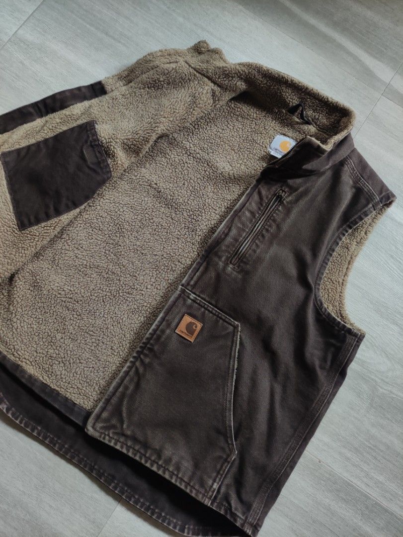 Carhartt 2017 Sherpa-Lined Canvas Vest (Category: Coats, Jackets and Outerwear) located in Calamba. Submitted by alorbis96758 (Listing ID 1469431411, Image 3). Description: Chest Width : 22" Length Front : 24" Length Back : 26" Best Fit : Medium Boxy Color Rate : 9.2 Flaws : Minimal Fade on Zipper Lining.