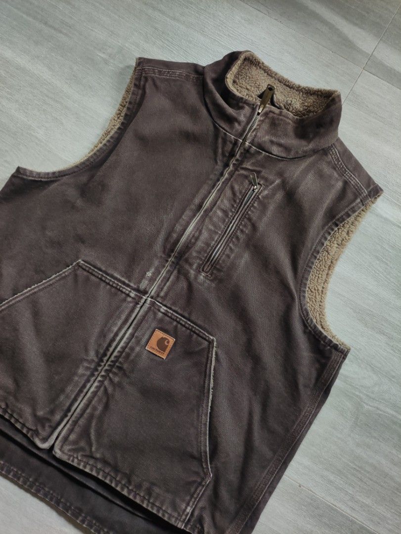 Carhartt 2017 Sherpa-Lined Canvas Vest (Category: Coats, Jackets and Outerwear) located in Calamba. Submitted by alorbis96758 (Listing ID 1469431411, Image 2). Description: Chest Width : 22" Length Front : 24" Length Back : 26" Best Fit : Medium Boxy Color Rate : 9.2 Flaws : Minimal Fade on Zipper Lining.