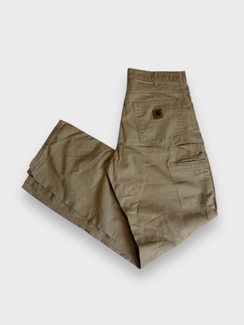 Carhartt Work In Progress Carpenter Pants Tan (Category: Jeans) located in Calauan. Submitted by lancesuerte13 (Listing ID 1469455002, Image 2). Description: - Color: Tan - Style: Double-knee carpenter pants with a relaxed fit - Features: Side utility pockets and left-leg hammer loop - Branding: Classic Carhartt logo patch on the back right pocket - Material: Sturdy, durable canvas - Condition/Vibe: Great streetwear staple that pairs with everyth