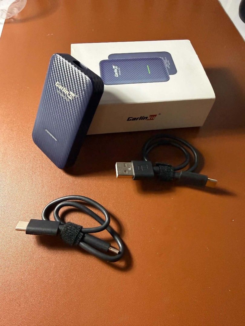Carlinkit CPC200-CP2A Wireless CarPlay Adapter (Category: Chargers & Cables) located in Bacoor. Submitted by sepiyow (Listing ID 1469568001, Image 1). Description: - Product: CarlinKit CPC200-CP2A Wireless Adapter - Finish: Stylish blue carbon fiber texture - Function: Converts wired CarPlay/Android Auto to wireless - Inclusions: Original packaging box, 2x USB connection cables, and Velcro straps - Design: Compact size for neat console placement 