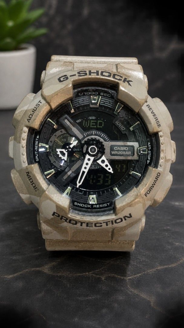 Casio G-Shock (Category: Men's Watches) located in Manila. Submitted by Decca0310 (Listing ID 1469472952, Image 2). Description: - Eye-catching full desert camouflage resin case and strap - Reliable analog and digital display with chronograph - Dark dial featuring sleek silver hands and hour markers - Tough build with prominent bezel guards for extra durability - 20BAR / 200M water resistance rating for swimming and diving - Secure standard buckl
