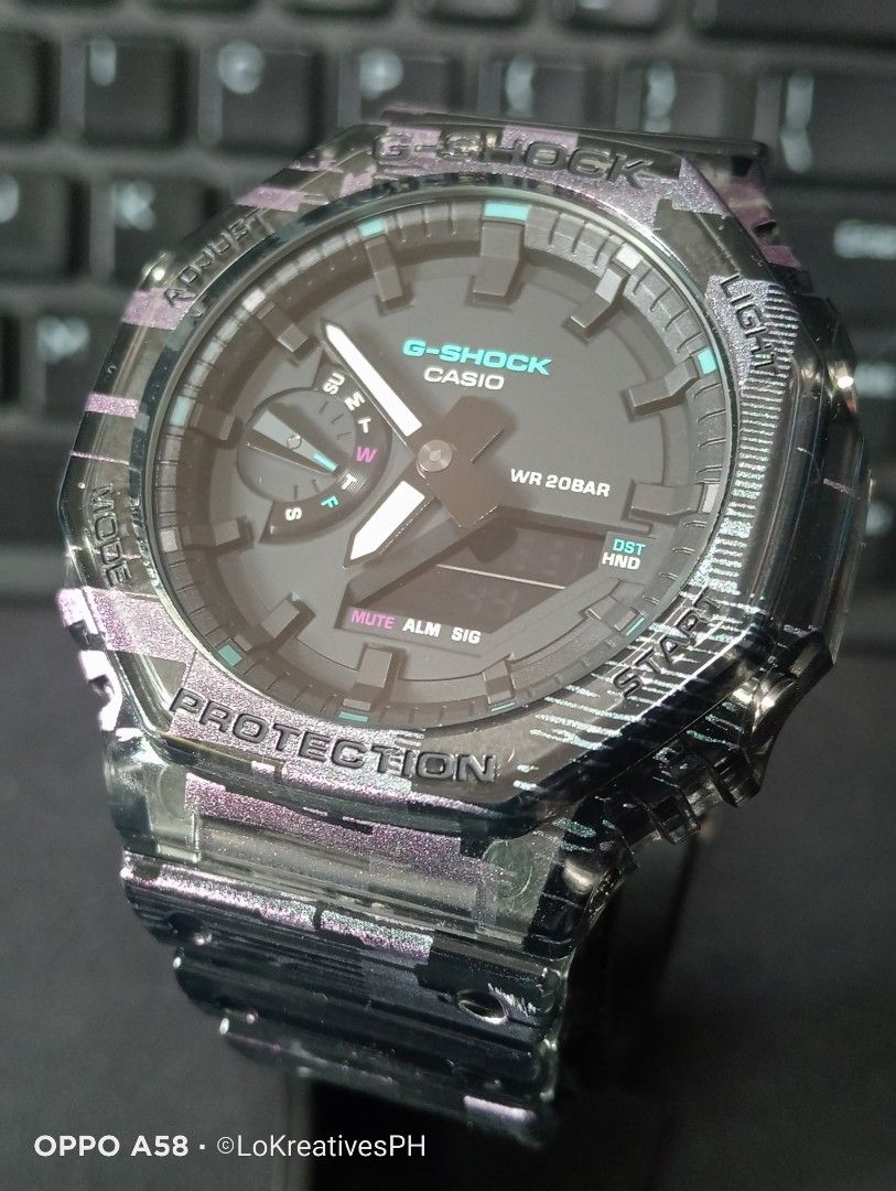 Gshock GA-2100NN-1A (Category: Men's Watches) located in Cavite. Submitted by purpose_served (Listing ID 1469570344, Image 2). Description: GA-2100NN ANALOG-DIGITAL 2100 Series GA-2100NN-1A Part of the "Digital Glitch" special series Basic Information Price: MSRP ₱10,000 +++ Case size: 48.5 × 45.4 × 11.8 mm Weight: 51 g Case: Carbon Core Band: Transparent Shock Resistant 200-meter water resistance Mineral Glass Neobrite Things to know: - Gifted t
