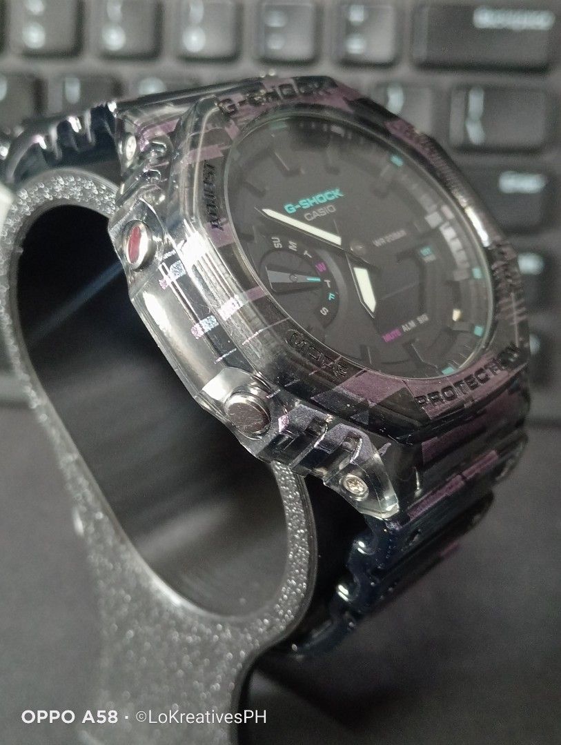 Gshock GA-2100NN-1A (Category: Men's Watches) located in Cavite. Submitted by purpose_served (Listing ID 1469570344, Image 3). Description: GA-2100NN ANALOG-DIGITAL 2100 Series GA-2100NN-1A Part of the "Digital Glitch" special series Basic Information Price: MSRP ₱10,000 +++ Case size: 48.5 × 45.4 × 11.8 mm Weight: 51 g Case: Carbon Core Band: Transparent Shock Resistant 200-meter water resistance Mineral Glass Neobrite Things to know: - Gifted t