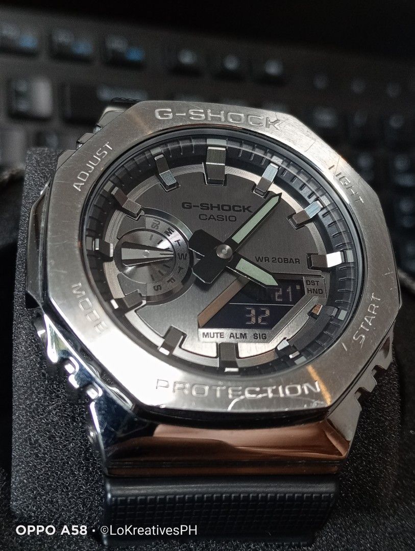 Gshock GM-2100-1A (Category: Men's Watches) located in Cavite. Submitted by purpose_served (Listing ID 1469468515, Image 3). Description: GM-2100-1A G-STEEL GM-2100 Series GM-2100-1A Metal-clad analog-digital watch featuring an iconic octagonal stainless steel bezel with a circular hairline finish and a black resin strap Basic Information Price: MSRP ₱16,000 +++ Case size: 49.3 × 44.4 × 11.8 mm Weight: 72 g Case: Stainless steel Band: Resin Shock