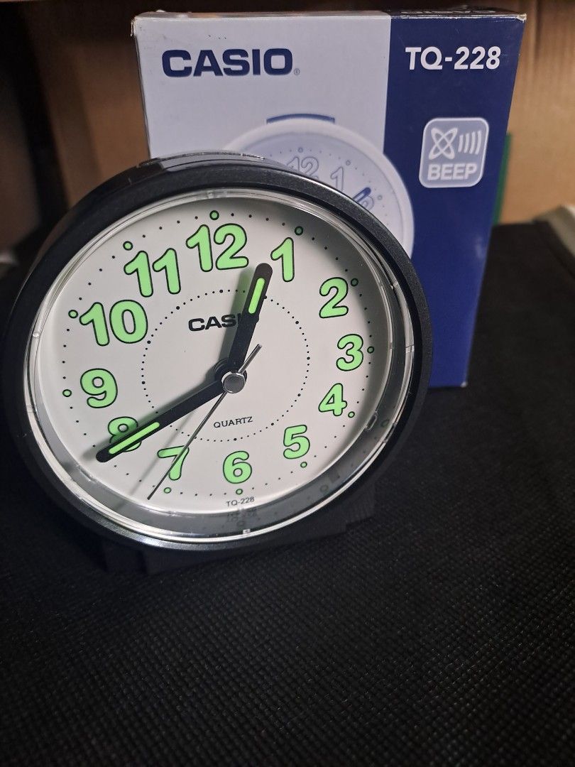 Casio TQ-228 Quartz Alarm Clock (Category: Clocks) located in Quezon City. Submitted by ph_araoh (Listing ID 1469435263, Image 1). Description: Casio TQ-228 Quartz Alarm Clock Classic black with white face Big green luminous numbers for easy night reading - Alarm: Loud beep that easily wakes you up - Power: Uses 1 standard AA battery (included) - Inclusion: Original box -Like new condition .