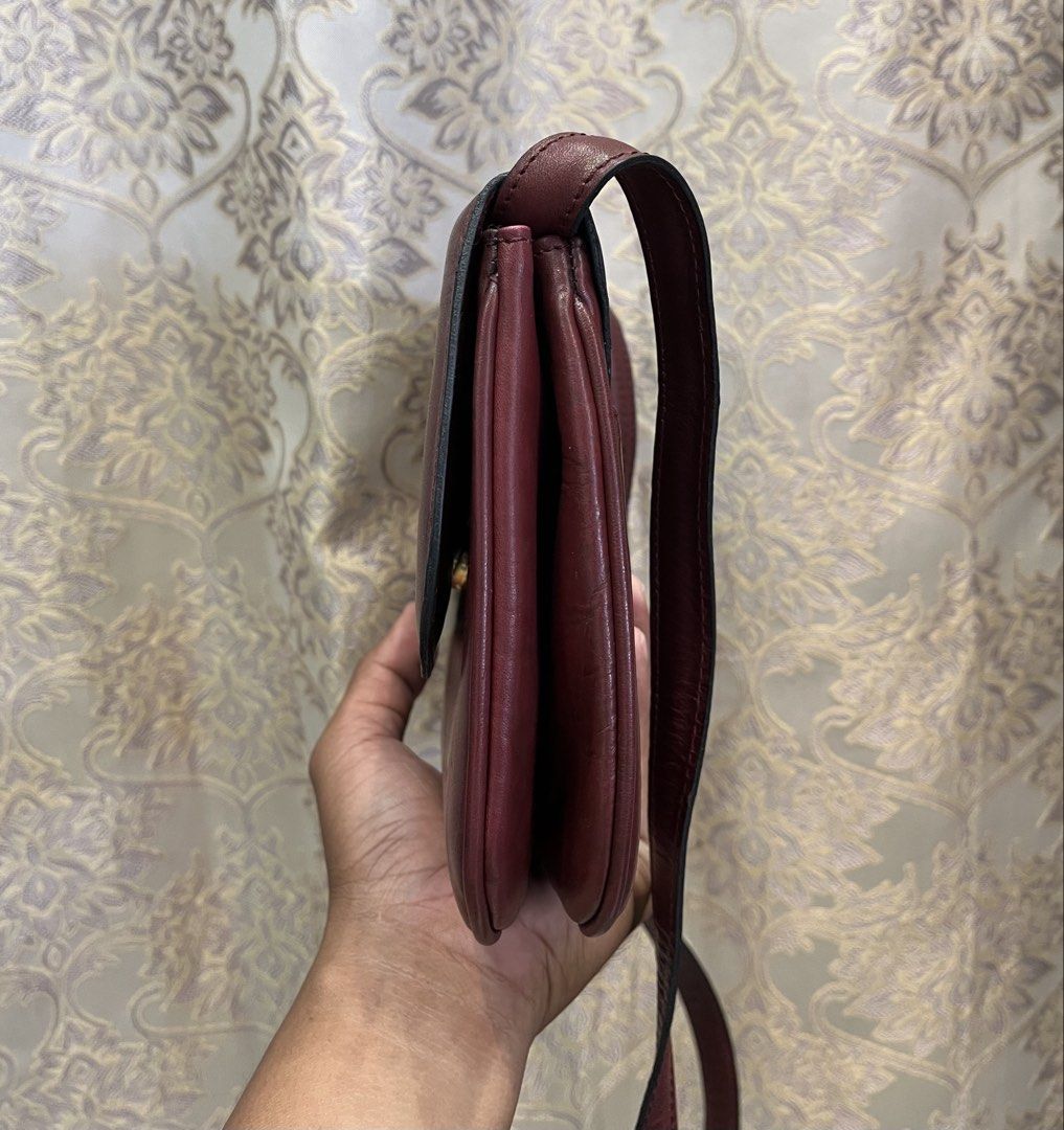 Celine Burgundy Leather Shoulder Bag (Category: Luxury Bags & Wallets) located in General Santos City (Dadiangas). Submitted by thiftnibadi3 (Listing ID 1469444796, Image 2). Description: - Authentic Celine crossbody bag in a rich burgundy leather - Elegant gold-tone hardware and front clasp closure - Structured accordion design with multiple interior compartments and a zippered pocket - Classic tan leather interior lining - Adjustable shoulder s