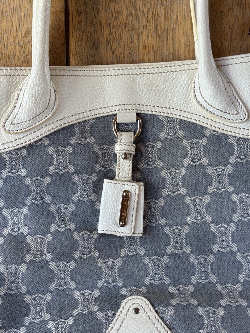 CELINE Macadam Triomphe Denim Tote (Category: Luxury Bags & Wallets) located in Davao. Submitted by _iconculture (Listing ID 1469506871, Image 2). Description: AVAILABLE • CELINE Macadam Triomphe Denim Tote ★ A beautiful archival piece designed during Michael Kors’ era at Celine in 2006. Condition: 9.5/10 — Very good overall condition. Has a small stain at the back that goes unnoticable. The body remains in excellent condition and looks almost ne