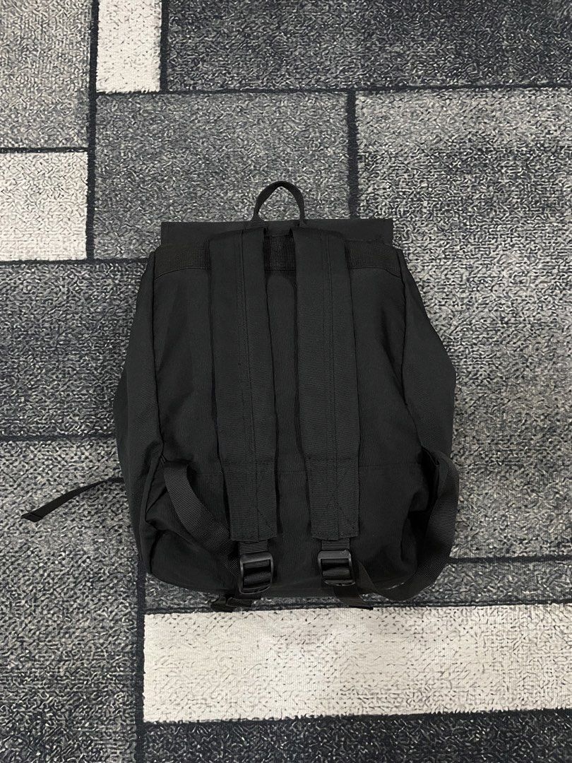 Champion Black Flap Backpack No issues! excellent condition! (Category: Backpacks) located in Moalboal. Submitted by thrift_club (Listing ID 1469537164, Image 2). Description: - Brand: Champion - Color: Classic Black - Material: Durable canvas - Closure: Flap with dual plastic buckles - Branding: Embroidered C logo on front flap - Interior: Features all-over Champion script logo pattern - Comfort: Adjustable padded shoulder straps and top carry l