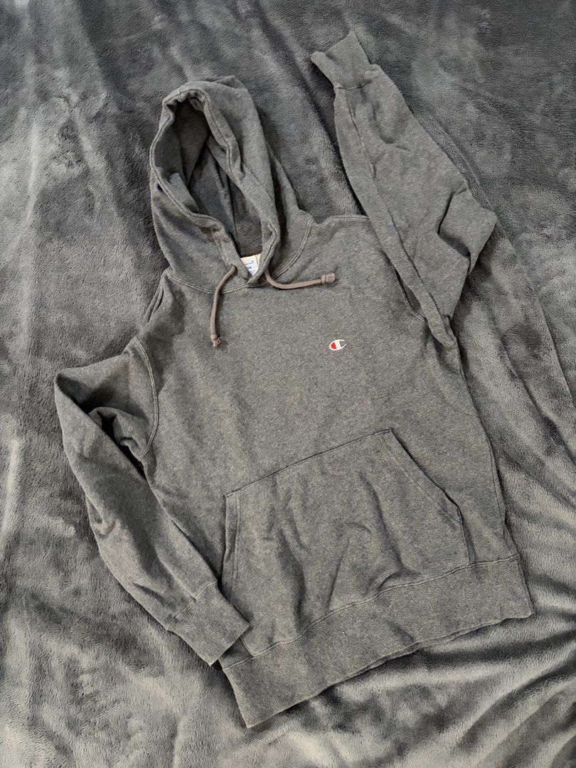 Champion Gray Hoodie Medium (Category: Hoodies) located in Quezon City. Submitted by marifavo (Listing ID 1469444971, Image 1). Description: - Brand: Champion - Color: Dark Gray - Size: Medium (tag inside collar) - Material: Soft fleece interior lining for maximum comfort - Details: Classic front kangaroo pocket, matching drawstring hood, and ribbed cuffs and hem - Branding: Embroidered Champion logo patch on the chest - Condition: Great everyday
