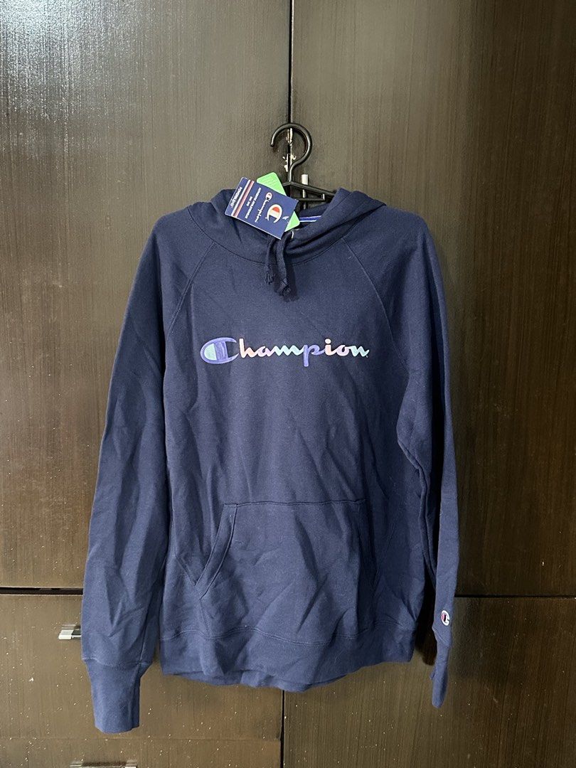 Champion Navy Blue Hoodie with Pastel Script Logo (Category: Coats, Jackets and Outerwear) located in Manila. Submitted by jherseysamonte06_ (Listing ID 1469416580, Image 1). Description: - Brand new with tags still attached - Color: Navy blue with pastel multi-color embroidered script logo - Classic hoodie design with adjustable drawstring - Features a spacious front kangaroo pocket - Ribbed cuffs and hem for a snug fit - Signature small Champio