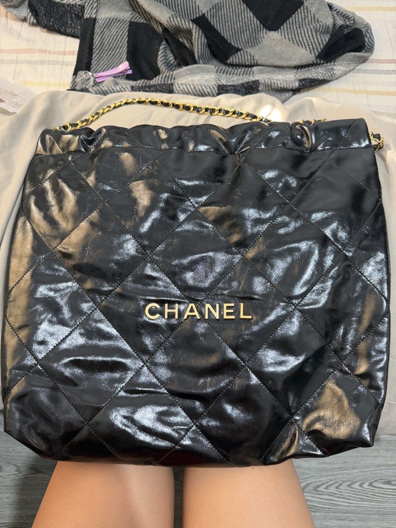 Chanel Black 22 Quilted Leather Shoulder Bag (Category: Luxury Bags & Wallets) located in Quezon City. Submitted by skyleeeee (Listing ID 1469465763, Image 1). Description: - NGA (Japan Sourced) - Color: Sleek black with shiny finish - Material: Premium quilted leather - Hardware: Elegant gold-tone with engraved branding - Design: Classic diamond pattern with structured sides and soft slouchy body - Straps: Luxurious gold chain woven with leather