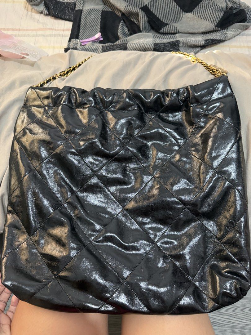 Chanel Black 22 Quilted Leather Shoulder Bag (Category: Luxury Bags & Wallets) located in Quezon City. Submitted by skyleeeee (Listing ID 1469465763, Image 2). Description: - NGA (Japan Sourced) - Color: Sleek black with shiny finish - Material: Premium quilted leather - Hardware: Elegant gold-tone with engraved branding - Design: Classic diamond pattern with structured sides and soft slouchy body - Straps: Luxurious gold chain woven with leather