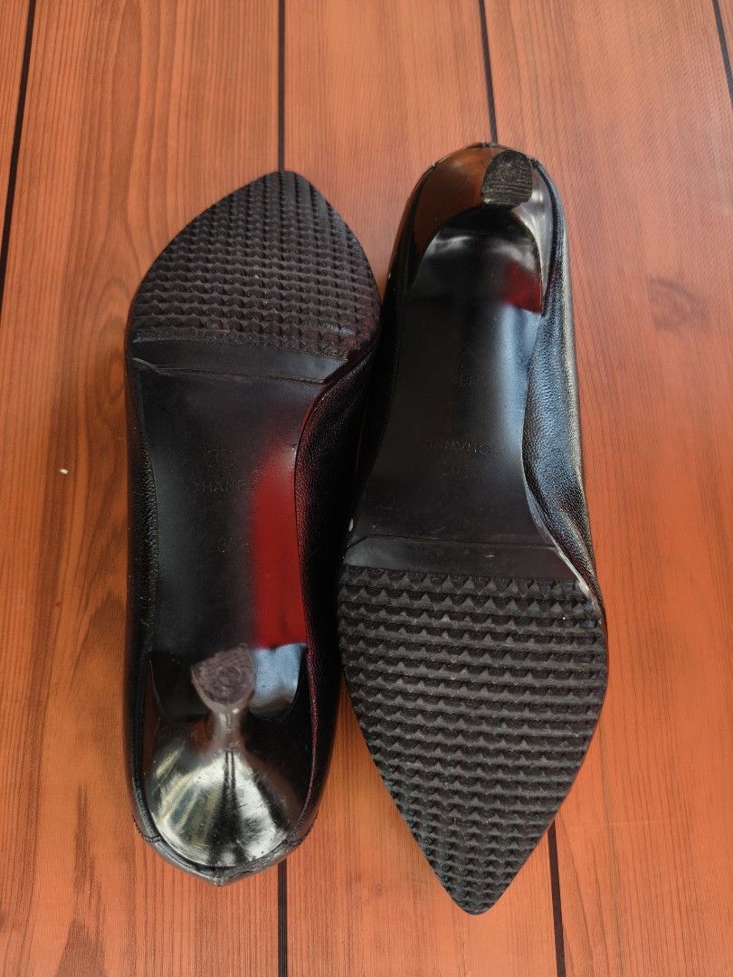 Chanel Black Leather Pointed Toe Heels (Category: Heels) located in Binan City. Submitted by makinpeso0622 (Listing ID 1469446612, Image 3). Description: - Brand: Chanel - Style: Black leather pumps with kitten heels - Size: 36.5 - Details: Pointed toes with CC logo, quilted interior lining, and metallic CC hardware on the heel counters - Soles: Textured rubber soles for extra grip - Condition: Moderate wear visible on the leather and toe tips - 