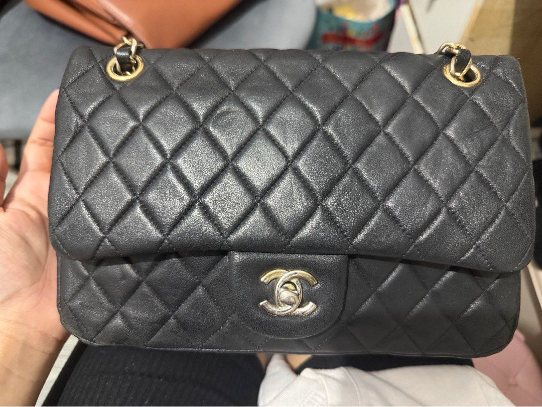 Chanel Double Flap (Category: Luxury Bags & Wallets) located in Quezon City. Submitted by skyleeeee (Listing ID 1469466292, Image 2). Description: - NGA (Japan sourced) - Chanel flap bag in classic black quilted leather - Luxurious gold-tone hardware with iconic turn-lock closure - Striking red leather interior lining with stitched interlocking CC logo - Stamped "Chanel Made in Italy" in gold lettering - Elegant, structured rectangular shape with