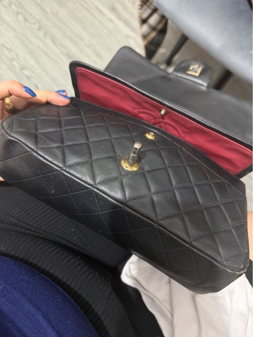 Chanel Double Flap (Category: Luxury Bags & Wallets) located in Quezon City. Submitted by skyleeeee (Listing ID 1469466292, Image 3). Description: - NGA (Japan sourced) - Chanel flap bag in classic black quilted leather - Luxurious gold-tone hardware with iconic turn-lock closure - Striking red leather interior lining with stitched interlocking CC logo - Stamped "Chanel Made in Italy" in gold lettering - Elegant, structured rectangular shape with