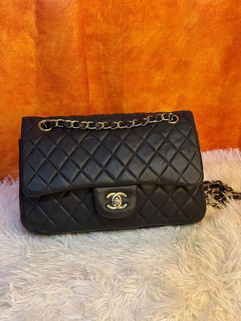 Chanel Double Flap (Category: Luxury Bags & Wallets) located in Quezon City. Submitted by skyleeeee (Listing ID 1469466292, Image 1). Description: - NGA (Japan sourced) - Chanel flap bag in classic black quilted leather - Luxurious gold-tone hardware with iconic turn-lock closure - Striking red leather interior lining with stitched interlocking CC logo - Stamped "Chanel Made in Italy" in gold lettering - Elegant, structured rectangular shape with