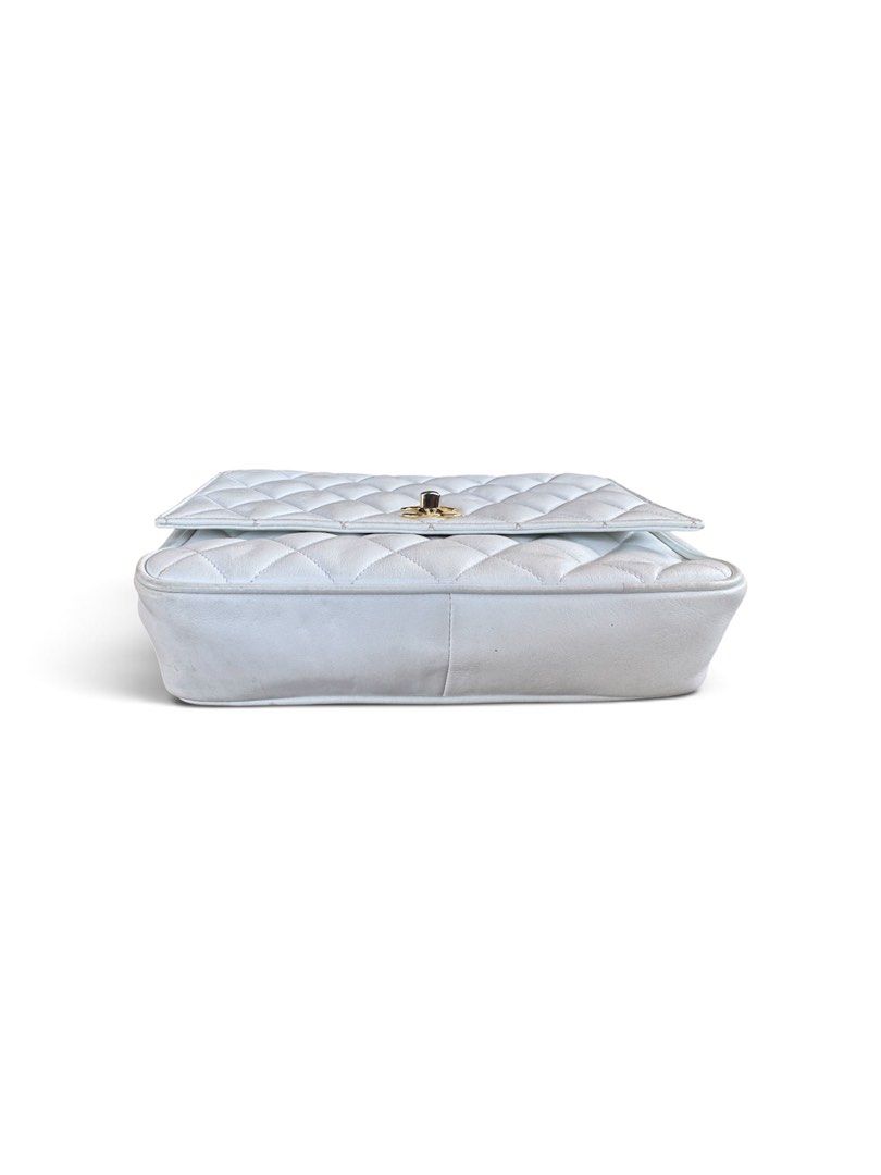Chanel Quilted White Leather Shoulder Bag (Category: Luxury Bags & Wallets) located in Lingayen. Submitted by lux_thrift (Listing ID 1469433333, Image 3). Description: location pangasinan approximately 18x21 cm minor signs of use missing hologram sticker no inclusion from japan surplus.