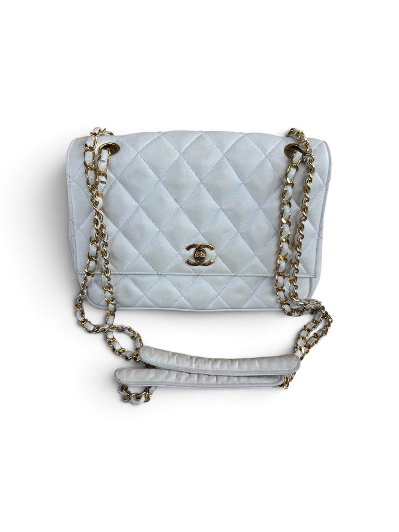 Chanel Quilted White Leather Shoulder Bag (Category: Luxury Bags & Wallets) located in Lingayen. Submitted by lux_thrift (Listing ID 1469433333, Image 1). Description: location pangasinan approximately 18x21 cm minor signs of use missing hologram sticker no inclusion from japan surplus.