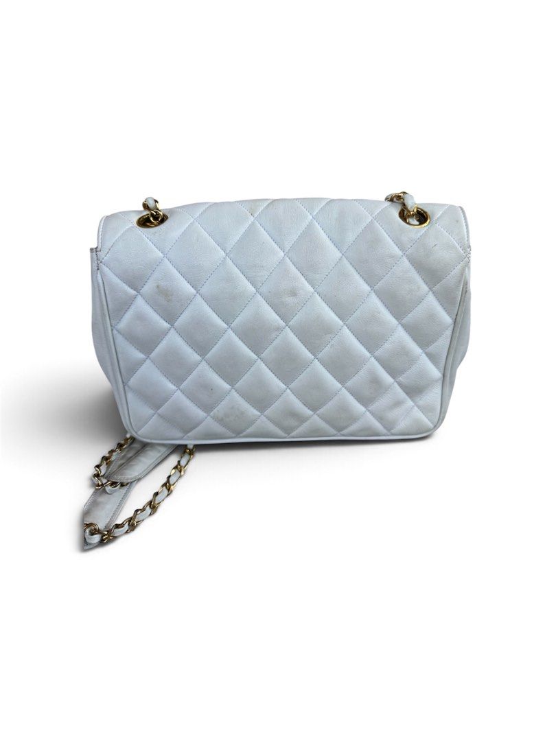 Chanel Quilted White Leather Shoulder Bag (Category: Luxury Bags & Wallets) located in Lingayen. Submitted by lux_thrift (Listing ID 1469433333, Image 2). Description: location pangasinan approximately 18x21 cm minor signs of use missing hologram sticker no inclusion from japan surplus.