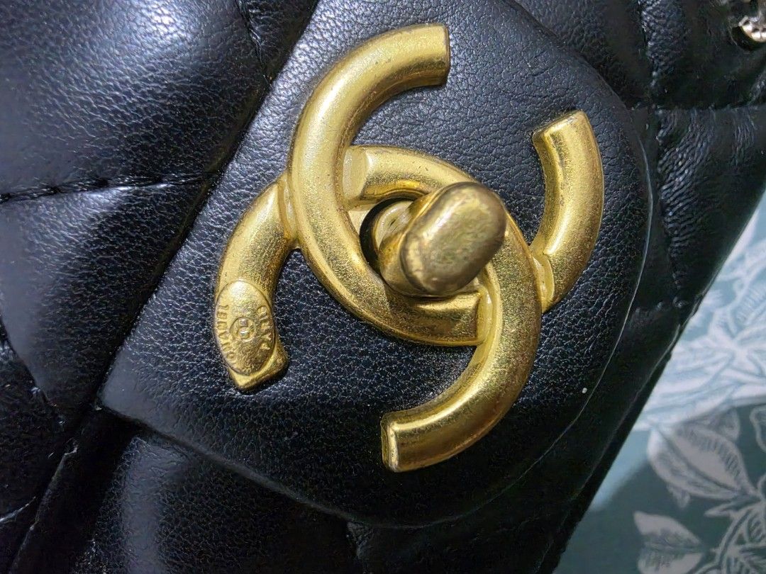 Chanel with Icons Charm Flap Bag (Category: Luxury Bags & Wallets) located in Quezon City. Submitted by skyleeeee (Listing ID 1469468695, Image 3). Description: - NGA (Japan Sourced) - Material: Premium black quilted leather - Hardware: Gold-tone with iconic interlocking CC turn-lock closure - Strap: Gold chain with interwoven leather for shoulder or crossbody wear - Special Details: Embellished with unique gold and rhinestone patches (CHANEL, RU
