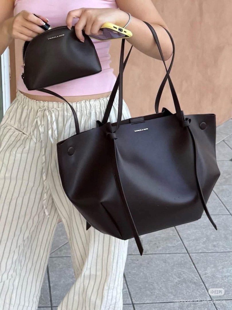 Charles & Keith Calla Tote Bag (Category: Shoulder Bags) located in Quezon City. Submitted by stuffs.hellyy (Listing ID 1469561868, Image 2). Description: Charles & Keith Calla Tote – Espresso 👜✨ giving classy, rich girl energy without even trying! 🤎 the perfect everyday bag that goes with literally everything. 😮‍💨✨ ♡ Large size ♡ With dust bag who’s claiming this beauty? 👀🤎.