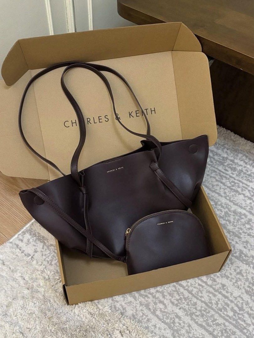 Charles & Keith Calla Tote Bag (Category: Shoulder Bags) located in Quezon City. Submitted by stuffs.hellyy (Listing ID 1469561868, Image 1). Description: Charles & Keith Calla Tote – Espresso 👜✨ giving classy, rich girl energy without even trying! 🤎 the perfect everyday bag that goes with literally everything. 😮‍💨✨ ♡ Large size ♡ With dust bag who’s claiming this beauty? 👀🤎.