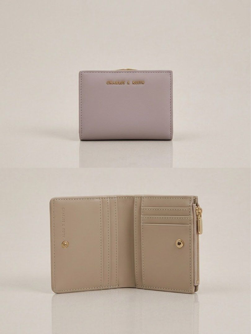 Charles & Keith Lilac Mini Wallet (Category: Wallets & Card holders) located in Quezon City. Submitted by rfclub (Listing ID 1469519610, Image 1). Description: Charles & Keith wallet in a soft lilac shade with gold hardware. Multiple card slots inside plus a zippered compartment on the side. Snap button closure keeps everything secure. Compact size fits easily into smaller bags. Clean design with clear branding on the front flap..