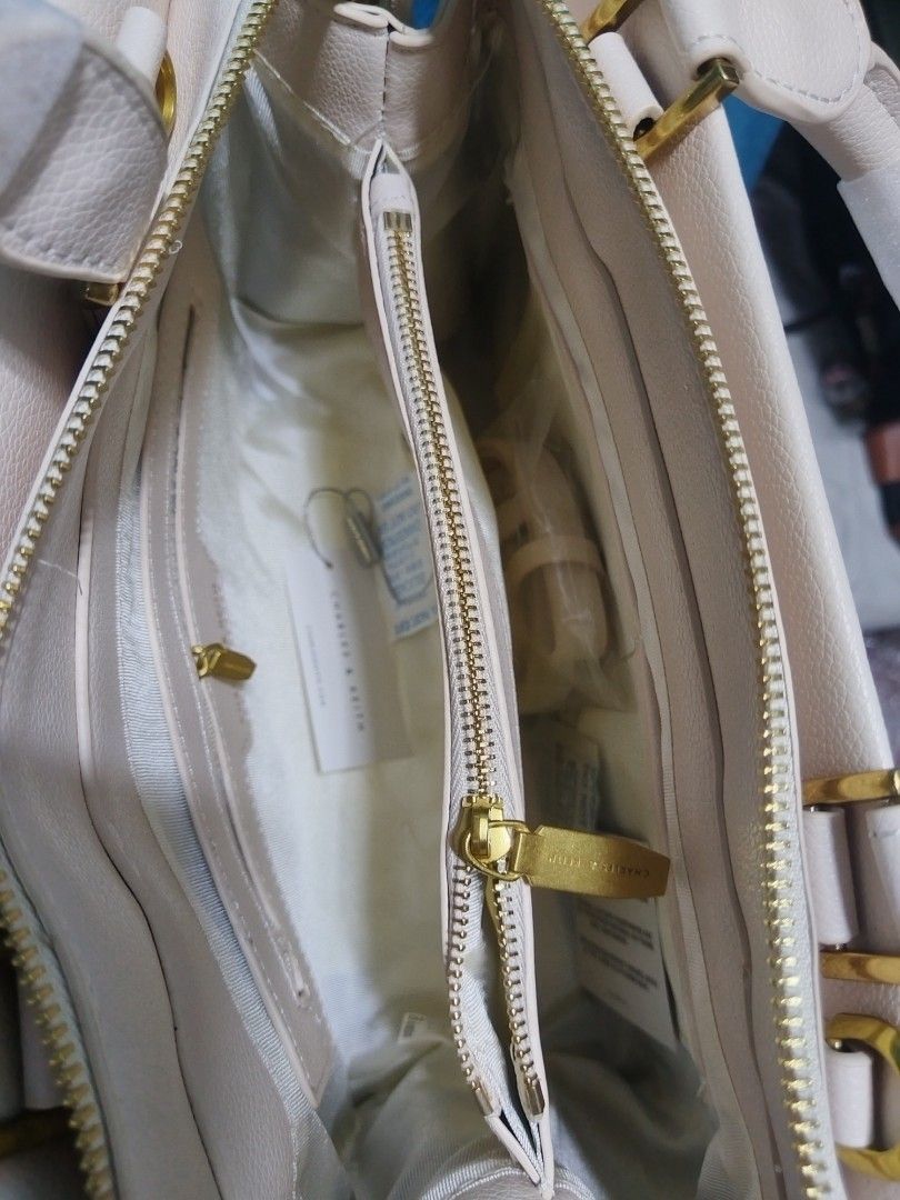 Charles n Keithz Structured Bag (Category: Beach Bags) located in Las Pinas. Submitted by jpmshoppe (Listing ID 1469469869, Image 2). Description: Charles n Keithz Structured Hand Bag with Sling Ivory white in color 3 comparments MPO bag.