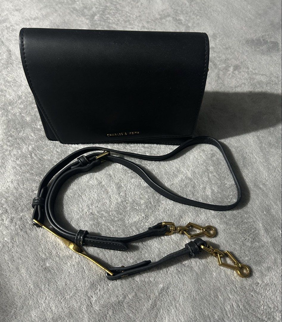 Charles&keith sling bag (Category: Cross-body Bags) located in Quezon City. Submitted by findsbyme_ (Listing ID 1469477520, Image 2). Description: With minor flaws see last photo.